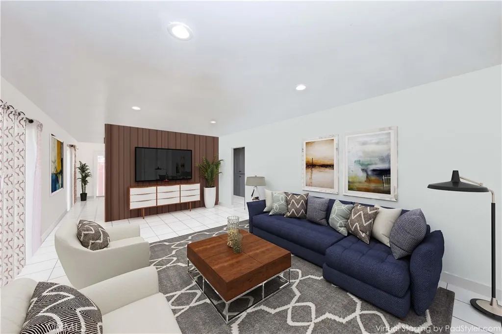 12292 Ranchero Avenue Garden Grove, CA 92843 - Photo 5 of 28 a living room with furniture and a flat screen tv