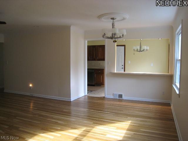 1092 Blanchester Road Lyndhurst, OH 44124 - Photo 6 of 12 Living - dining area w/wood flooring