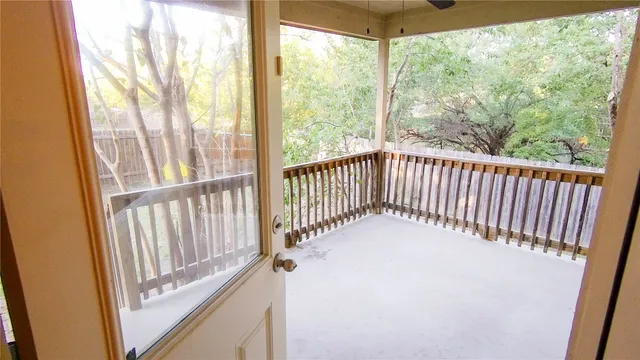 a view of a balcony with wooden floor