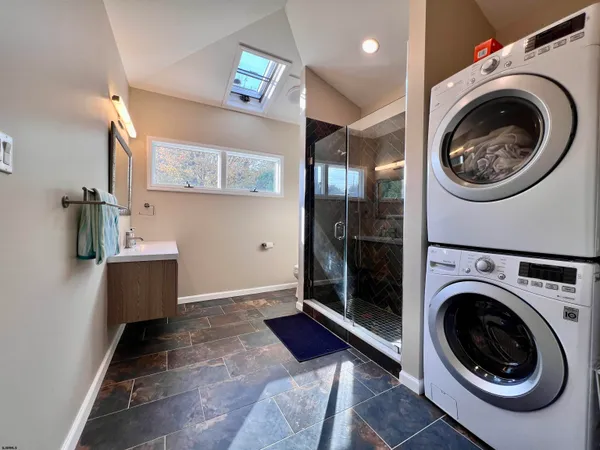 a view of a hallway with washer and dryer