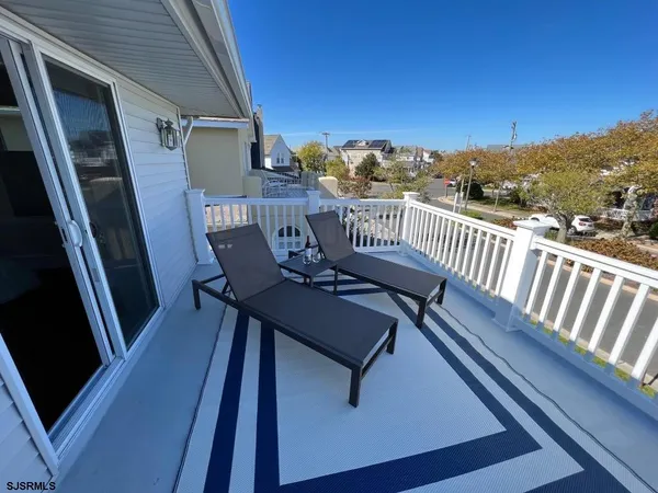 a view of balcony with furniture