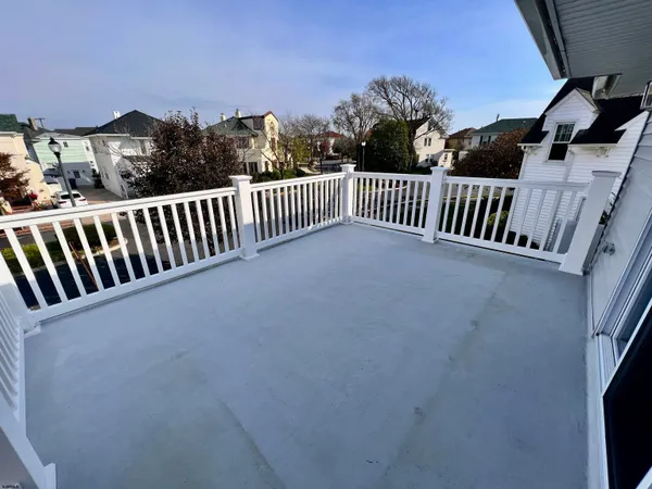 a view of balcony with wooden floor