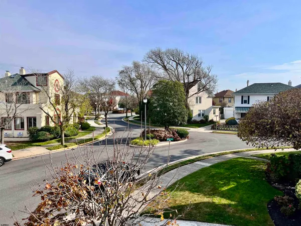 a view of a town with palm trees