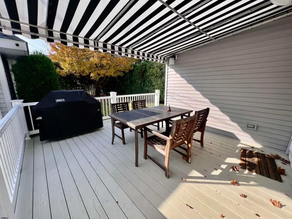 a view of backyard with sitting area