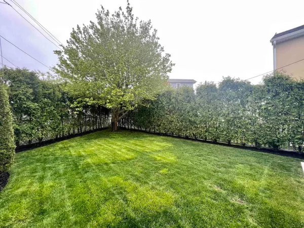 a view of a big yard with an outdoor space