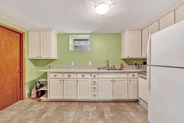 a bathroom with a sink a toilet and shower curtain