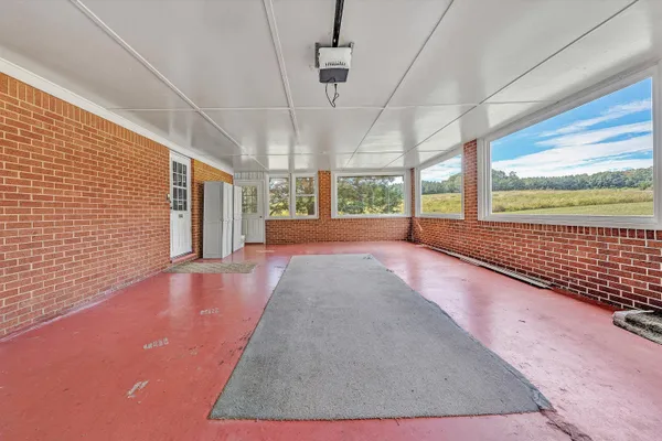 a view of balcony with wooden floor and fence