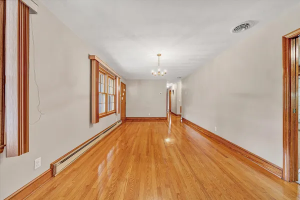 a view of livingroom with hardwood floor and a ceiling fan