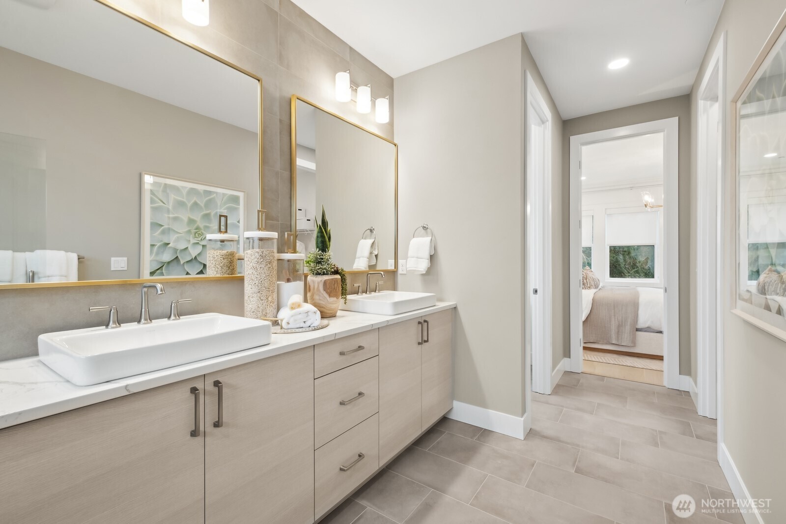 18913 99th Place Northeast, Unit A Bothell, WA 98011 - Photo 18 of 28 a en suite bathroom with a double vanity sink a mirror and a shower