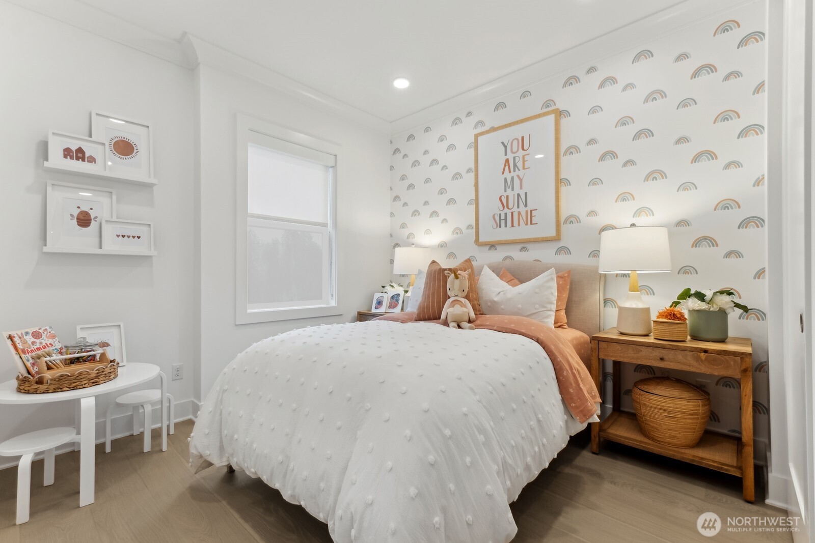 18913 99th Place Northeast, Unit A Bothell, WA 98011 - Photo 21 of 28 a bedroom with a bed and a table in it