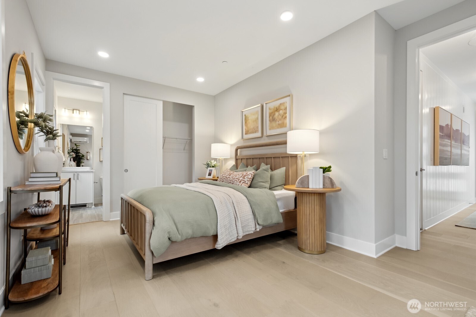 18913 99th Place Northeast, Unit A Bothell, WA 98011 - Photo 4 of 28 a spacious bedroom with a bed a table and painting