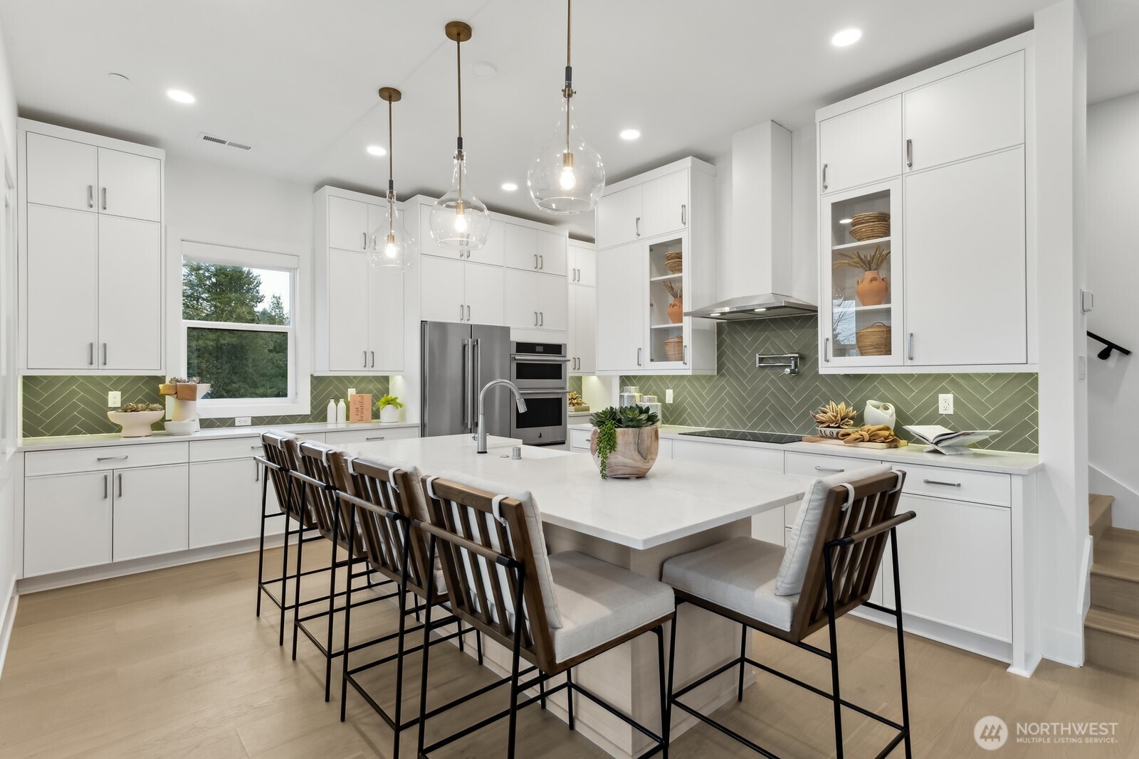 18913 99th Place Northeast, Unit A Bothell, WA 98011 - Photo 10 of 28 a large kitchen with a table and chairs in it
