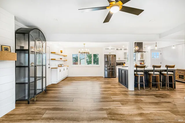 a view of a living room and kitchen view