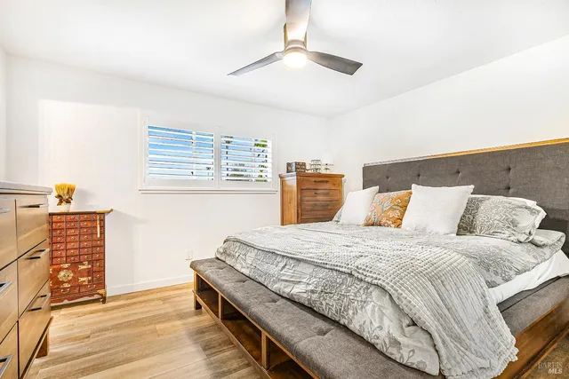 a bedroom with a bed and cabinets