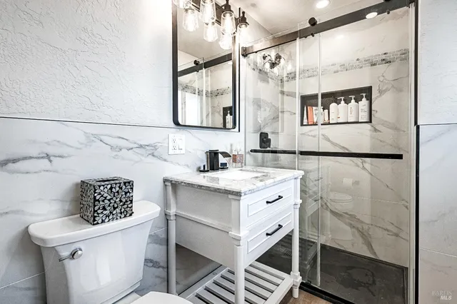 a bedroom with a bed and flat screen tv