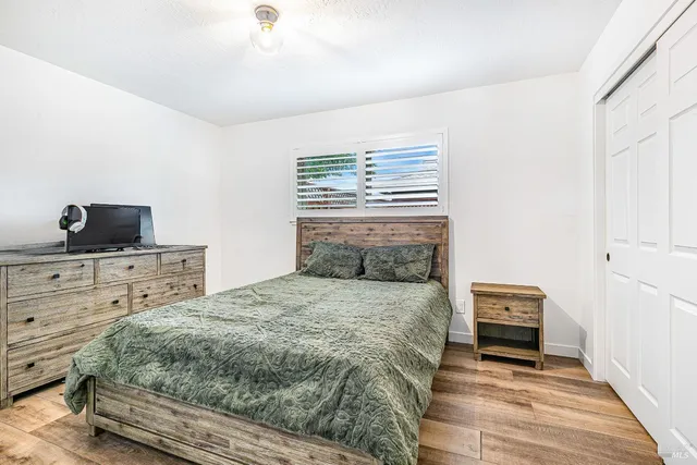 a bedroom with a bed and a chair