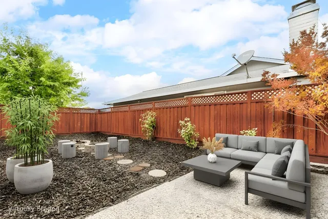 a view of a dinning table and chairs in the patio