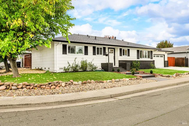 front view of a house with a small yard