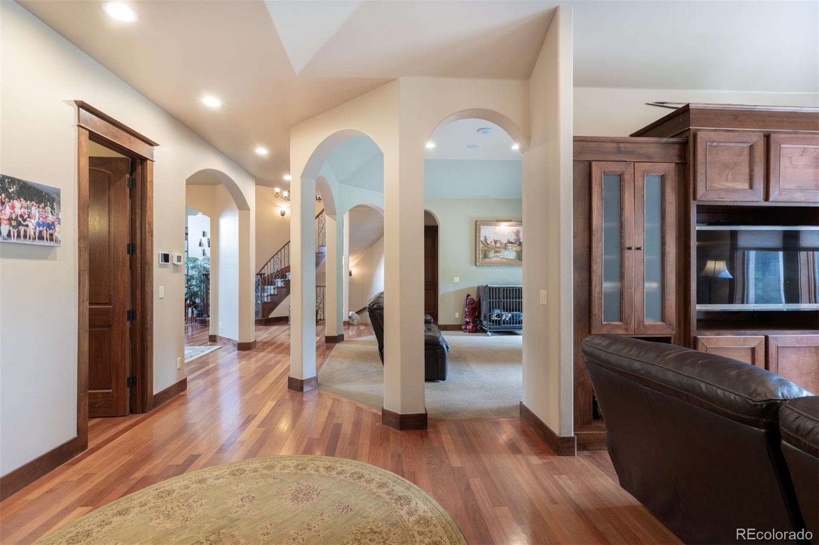 13680 Wide Acres Road Golden, CO 80401 - Photo 13 of 26 a view of living room and kitchen with wooden floor