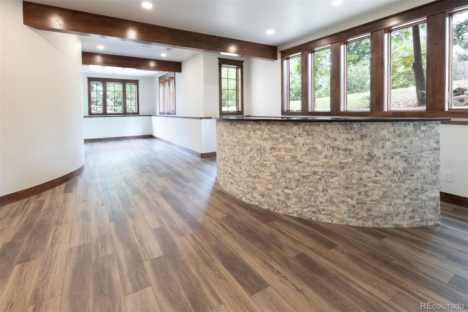 13680 Wide Acres Road Golden, CO 80401 - Photo 19 of 26 a view of an empty room with wooden floor and a window