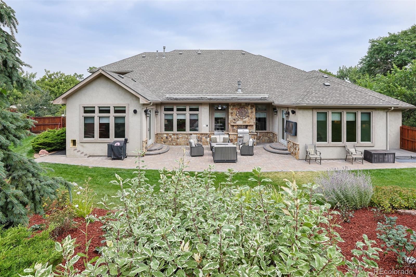 13680 Wide Acres Road Golden, CO 80401 - Photo 23 of 26 a front view of a house with a yard patio and fire pit