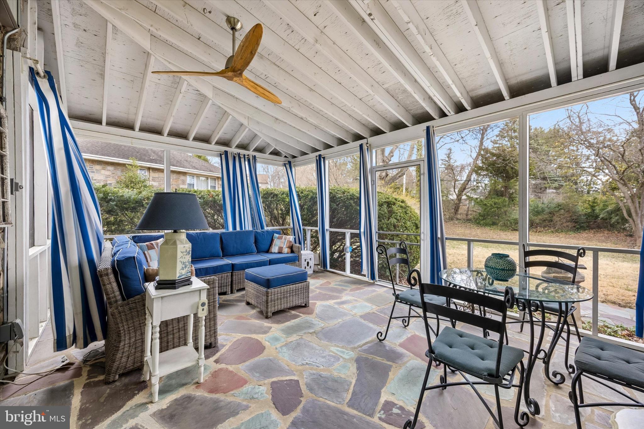 239 Brydon Road Wynnewood, PA 19096 - Photo 15 of 35 Serene sunroom with vibrant accents.
