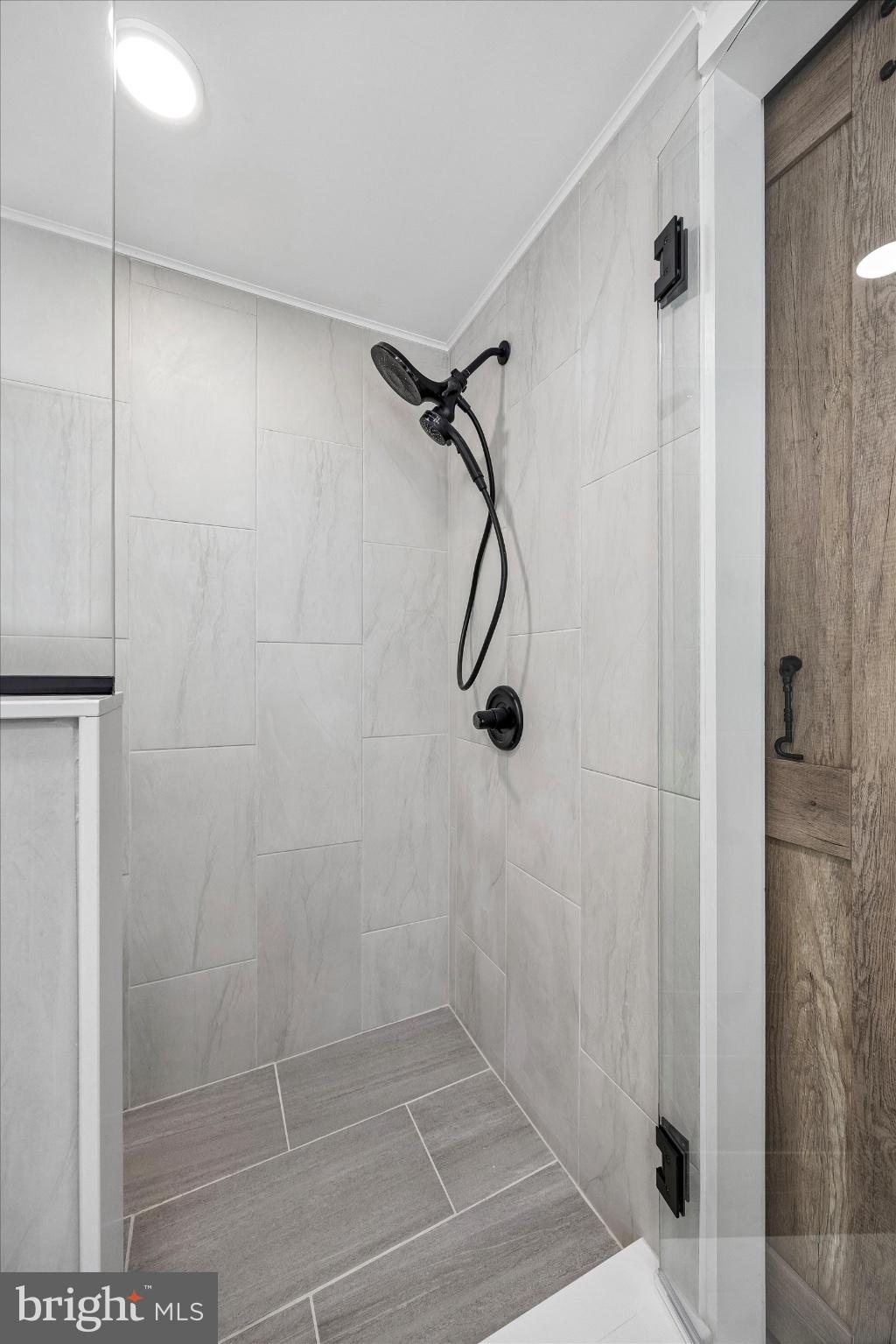239 Brydon Road Wynnewood, PA 19096 - Photo 31 of 35 Sleek modern shower with elegant tiles.