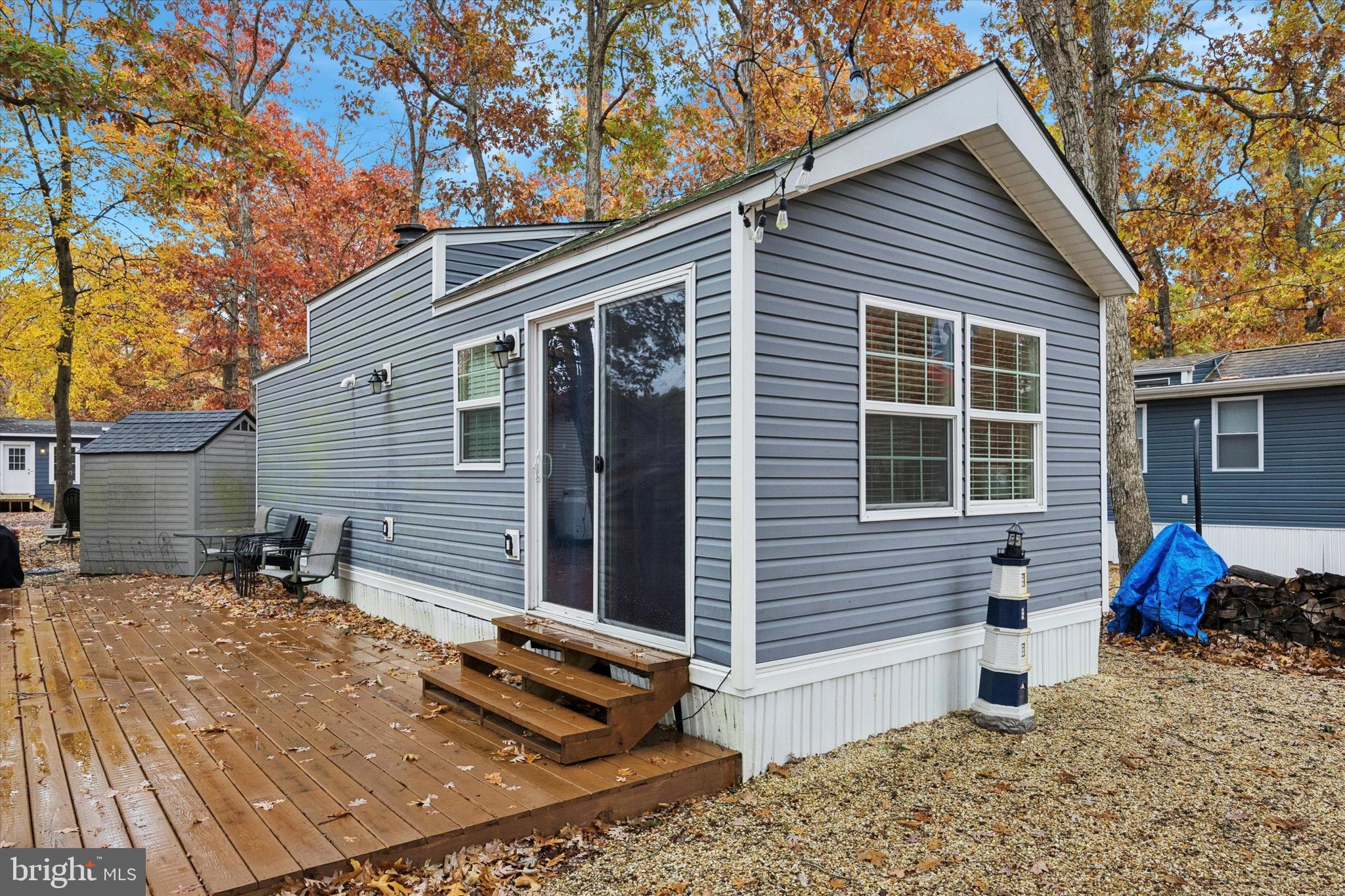 a backyard of a house with outdoor seating
