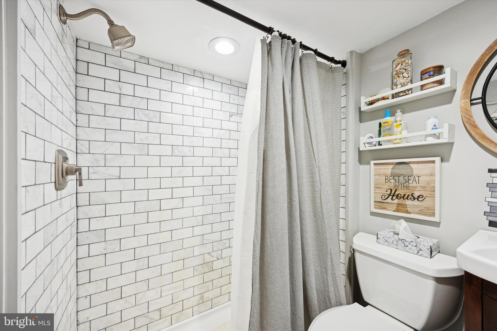 515 Corsons Tavern Road, Unit E 42 Ocean View, NJ 08230 - Photo 12 of 25 a bathroom with a shower toilet and sink