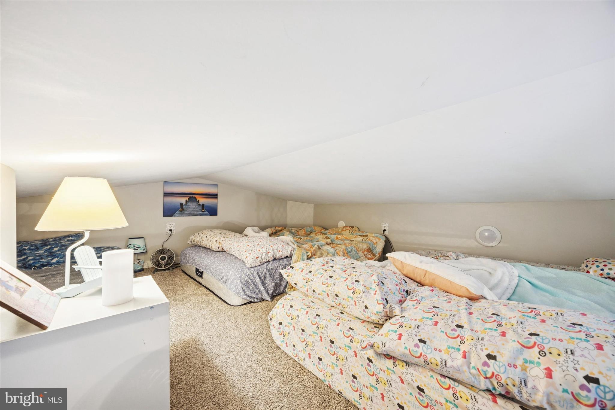 515 Corsons Tavern Road, Unit E 42 Ocean View, NJ 08230 - Photo 13 of 25 a bedroom with a bed and a lamp