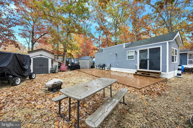 a view of a house with pool and sitting area