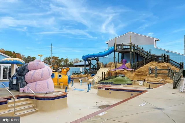 a view of a swimming pool with a lounge chairs