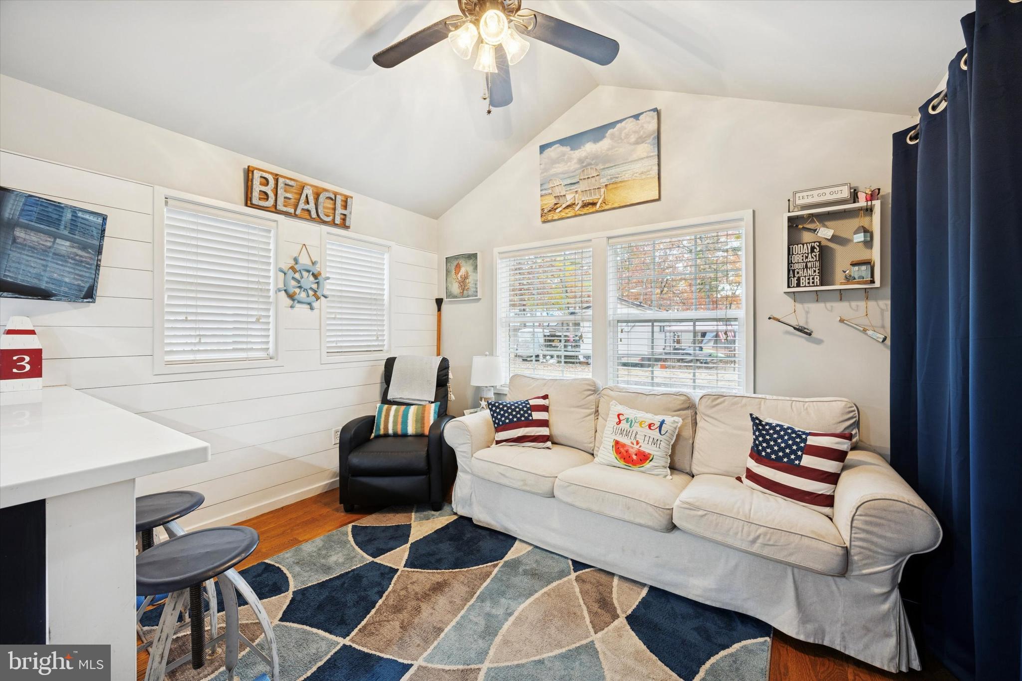 515 Corsons Tavern Road, Unit E 42 Ocean View, NJ 08230 - Photo 3 of 25 a living room with furniture and a flat screen tv