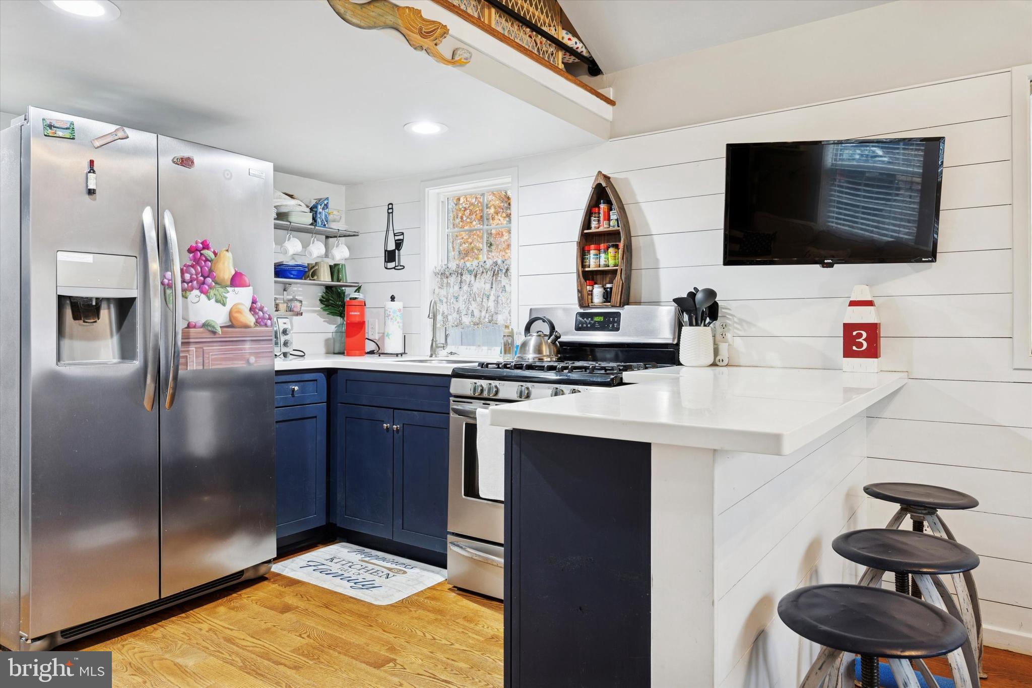 515 Corsons Tavern Road, Unit E 42 Ocean View, NJ 08230 - Photo 5 of 25 a kitchen with stainless steel appliances a stove refrigerator and microwave