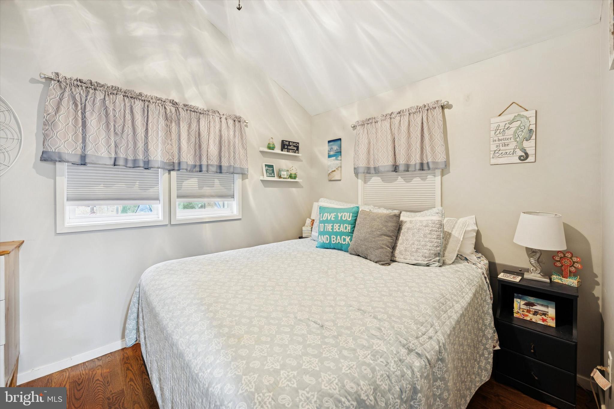 515 Corsons Tavern Road, Unit E 42 Ocean View, NJ 08230 - Photo 9 of 25 a bedroom with a bed a mirror and a window