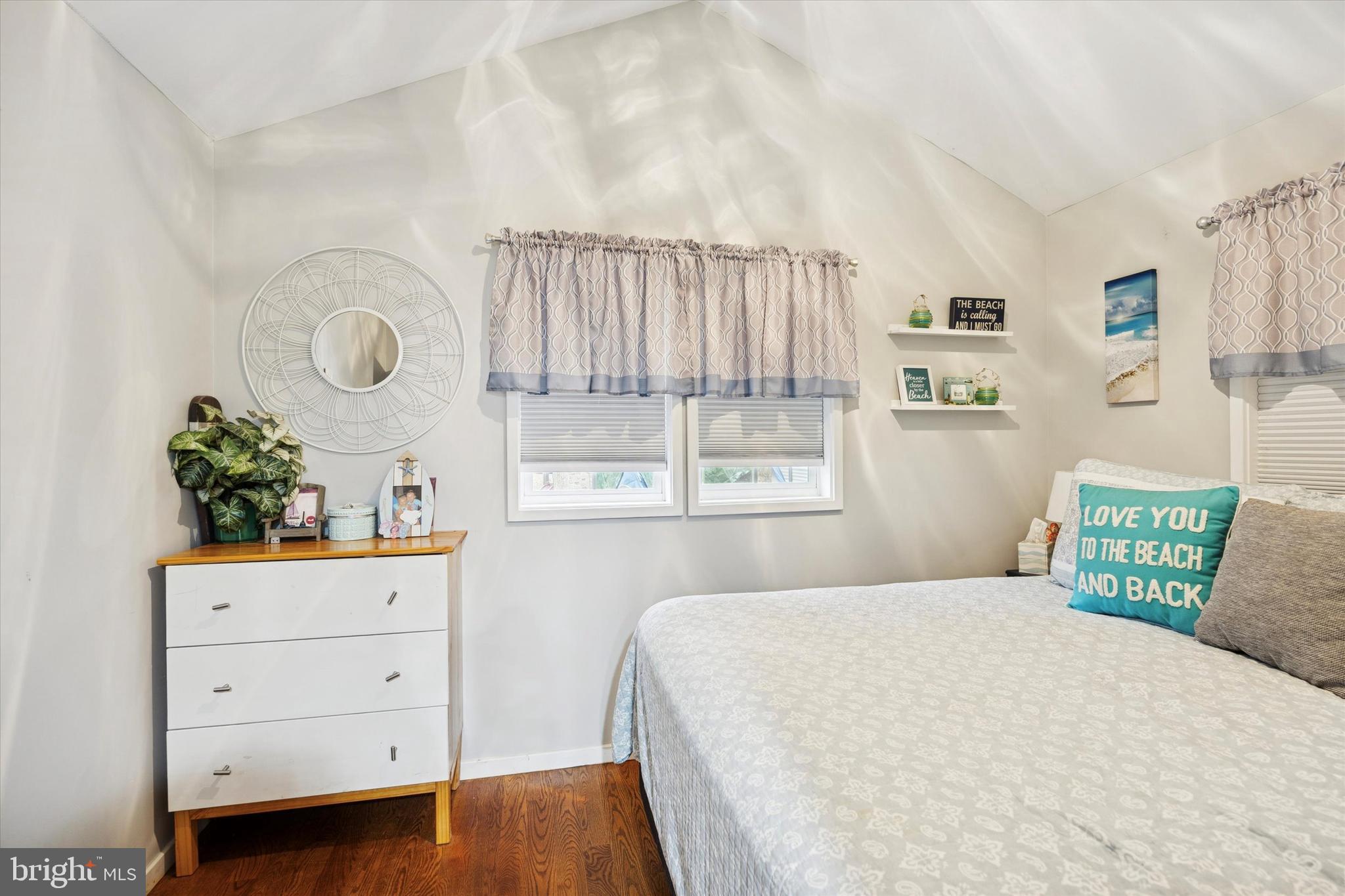 515 Corsons Tavern Road, Unit E 42 Ocean View, NJ 08230 - Photo 10 of 25 a bedroom with a bed and a window