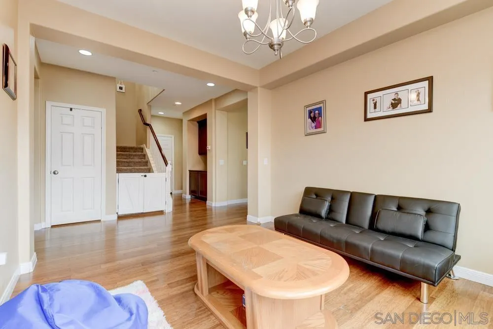1145 Los Senderos Drive Santee, CA 92071 - Photo 13 of 30 a living room with furniture and a chandelier