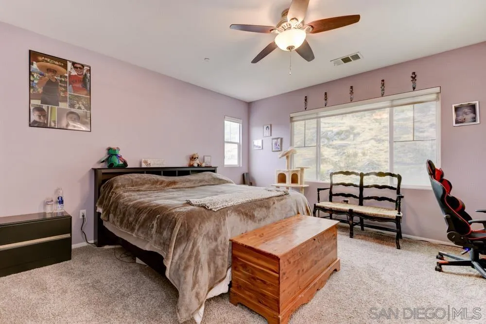 1145 Los Senderos Drive Santee, CA 92071 - Photo 16 of 30 a bedroom with a bed and a window