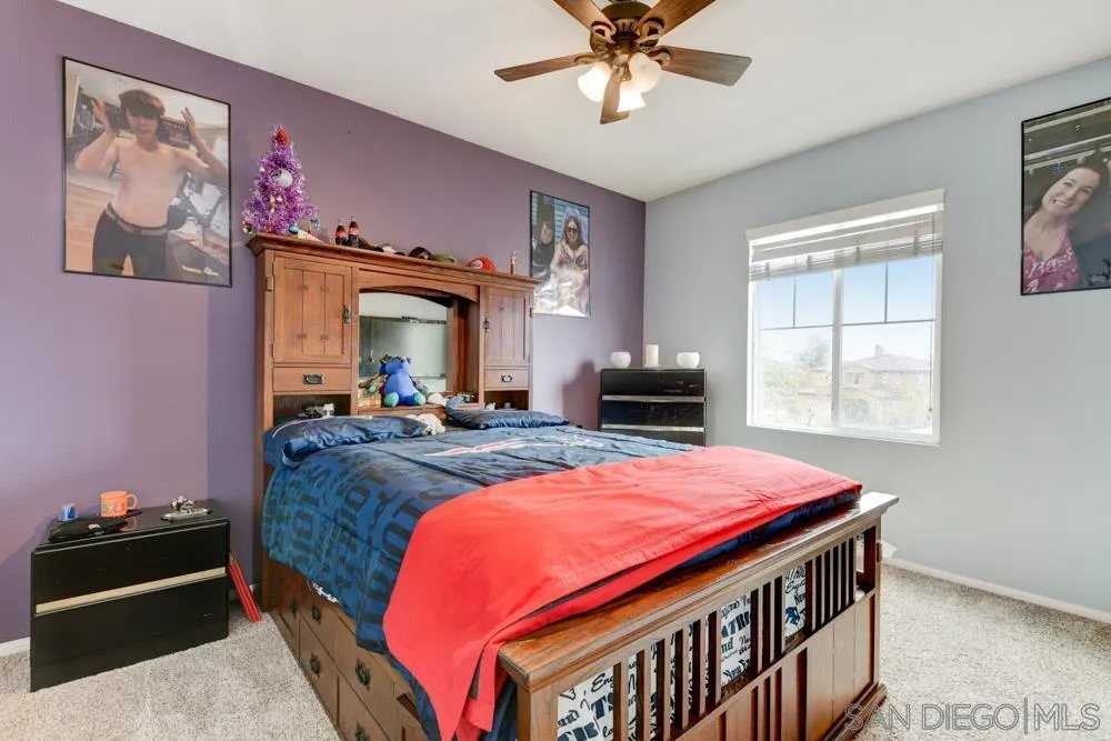 1145 Los Senderos Drive Santee, CA 92071 - Photo 19 of 30 a bed room with a bed and a television