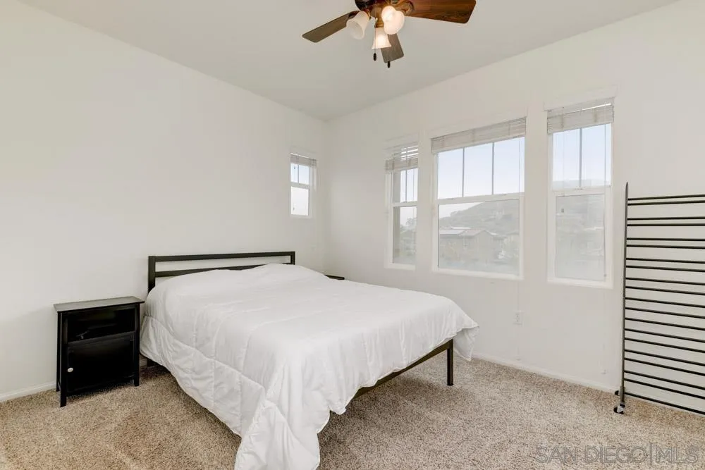 1145 Los Senderos Drive Santee, CA 92071 - Photo 21 of 30 a bed sitting in a bedroom next to a window