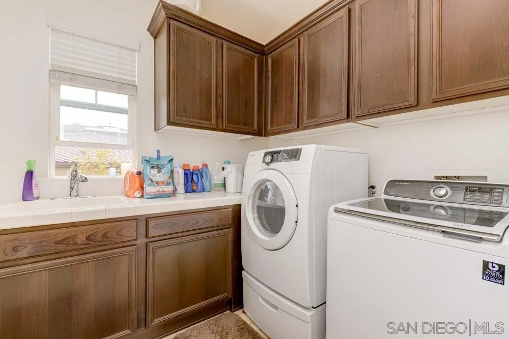 1145 Los Senderos Drive Santee, CA 92071 - Photo 22 of 30 a utility room with sink dryer and washer