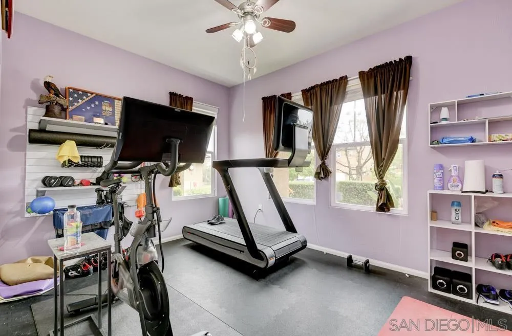 1145 Los Senderos Drive Santee, CA 92071 - Photo 23 of 30 a living room with furniture a flat screen tv and a window