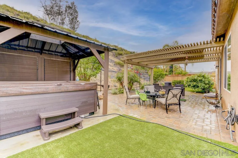 1145 Los Senderos Drive Santee, CA 92071 - Photo 26 of 30 a backyard of a house with table and chairs