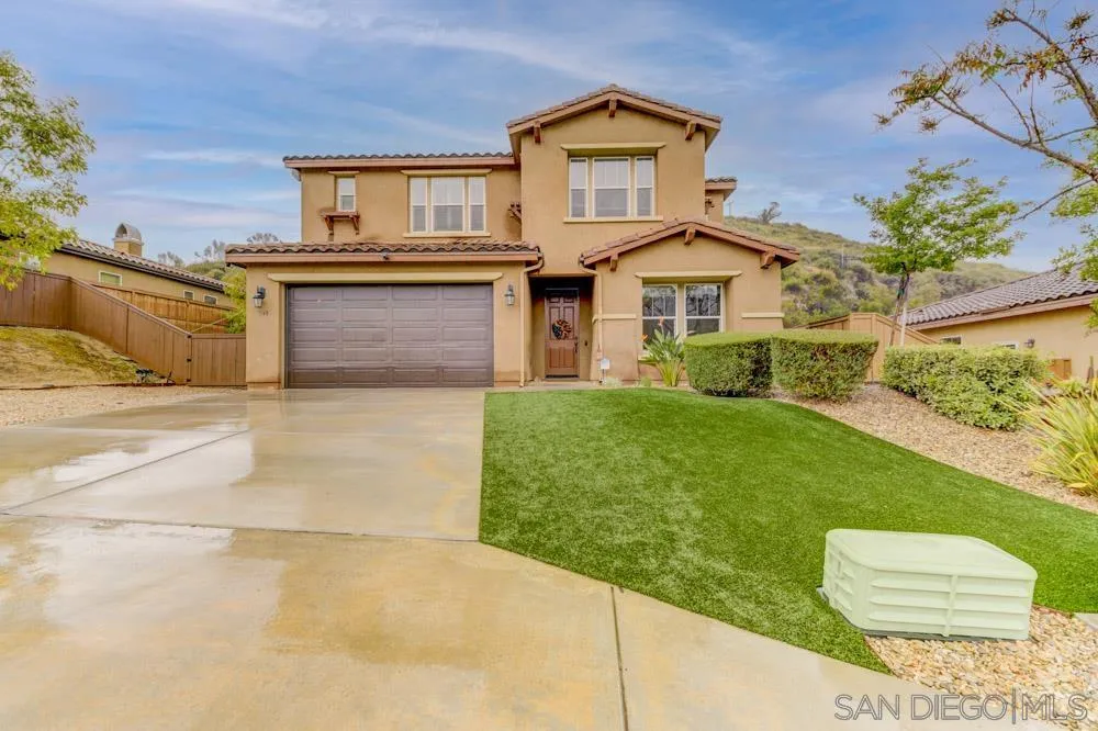 1145 Los Senderos Drive Santee, CA 92071 - Photo 3 of 30 a front view of a house with a yard