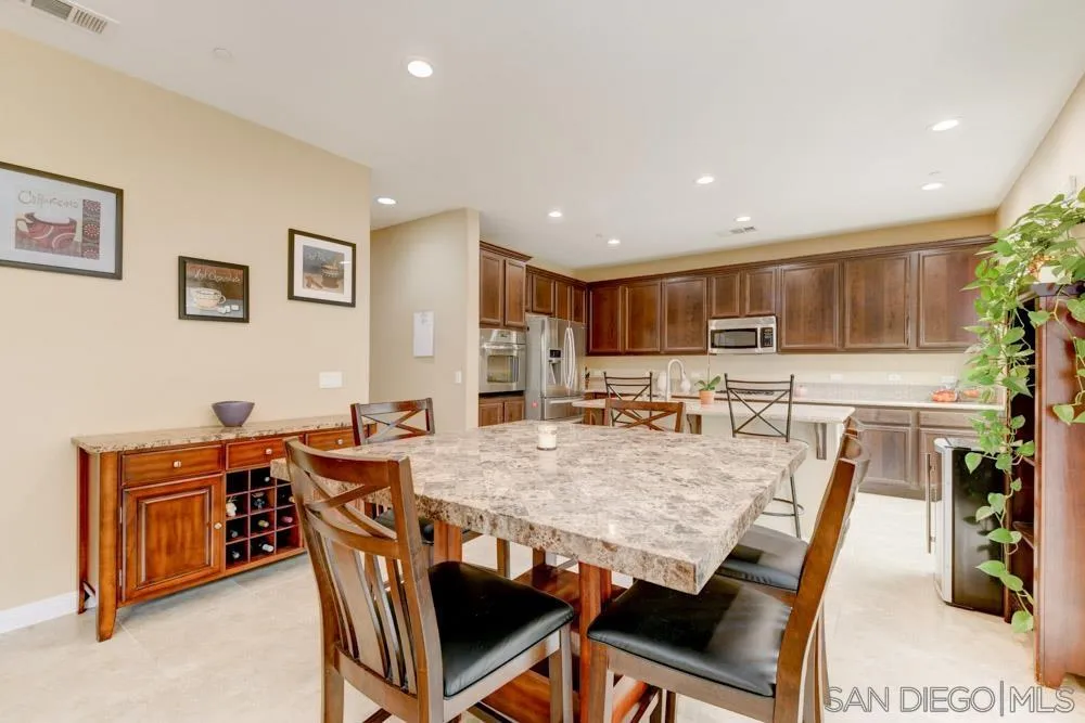 1145 Los Senderos Drive Santee, CA 92071 - Photo 8 of 30 a view of a dining room with furniture