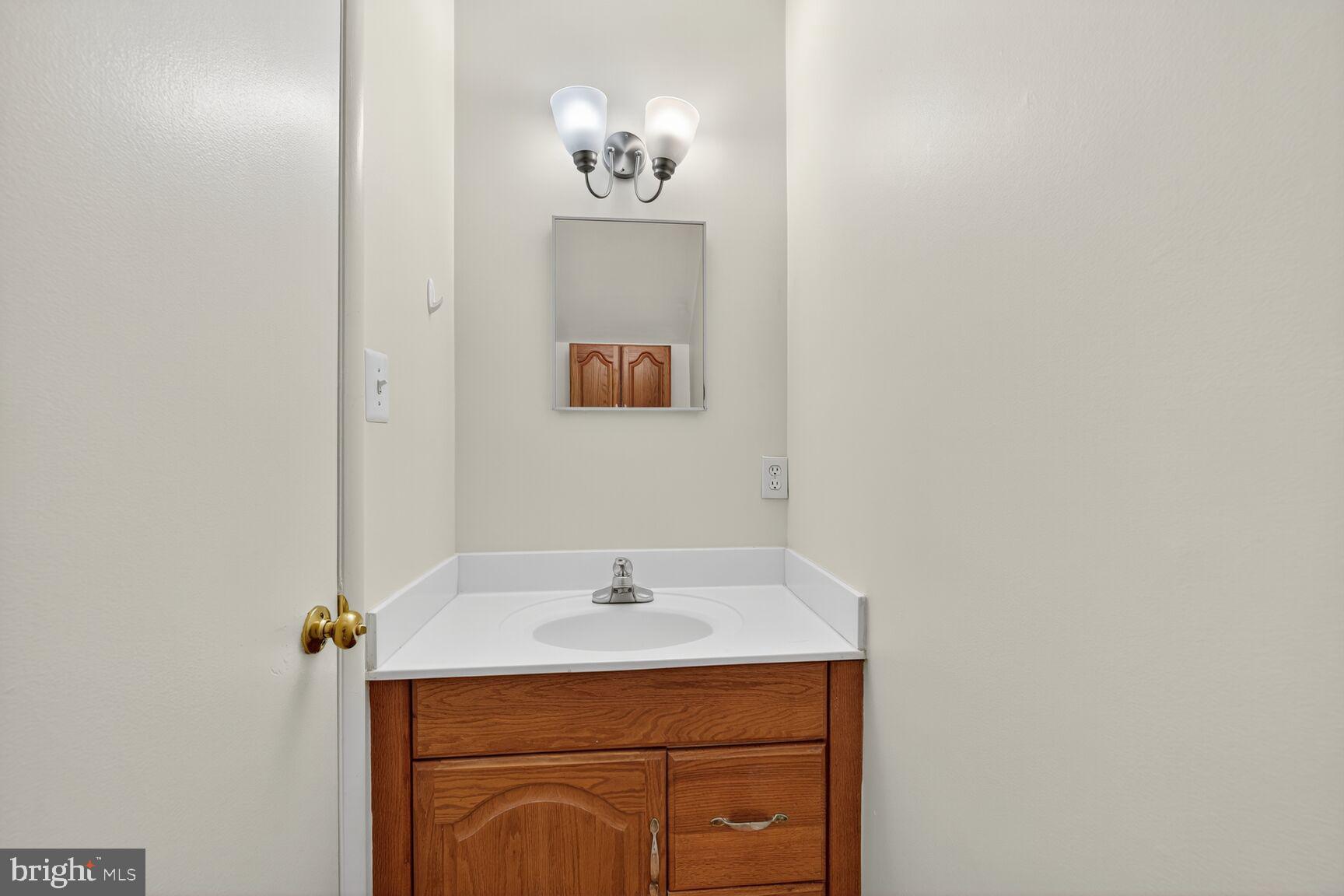 1384 Northgate Square Reston, VA 20190 - Photo 12 of 19 a bathroom with a sink and a mirror