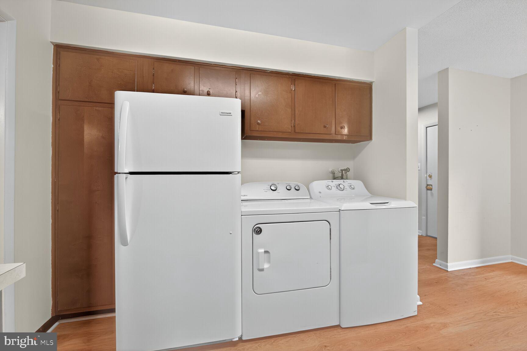 1384 Northgate Square Reston, VA 20190 - Photo 7 of 19 a utility room with dryer and washer