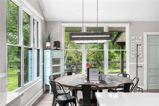a view of a dining room with furniture window and outside view