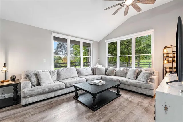 a living room with furniture and a large window