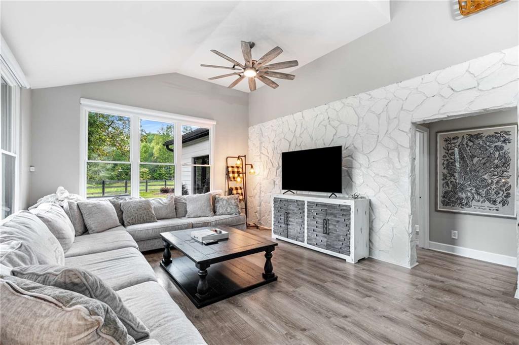 8393 Boardtown Road Ellijay, GA 30540 - Photo 14 of 54 a living room with furniture and a flat screen tv